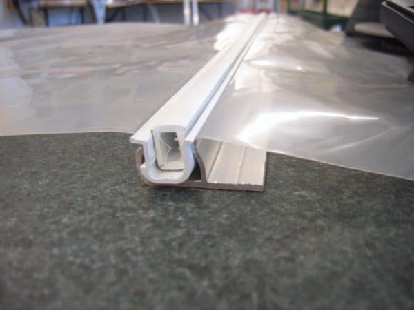 Duralock greenhouse film clipping system